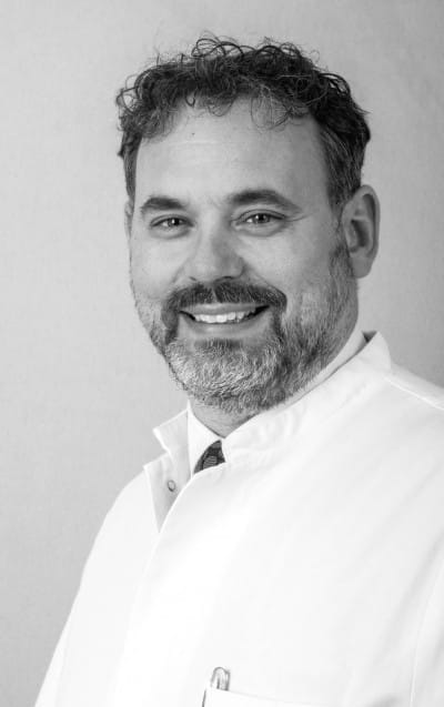 Porträt des Autors Prof. Dr. med. Achim Benditz, MHBA, Facharzt für Allgemeinchirurgie, Orthopädie und Unfallchirurgie.